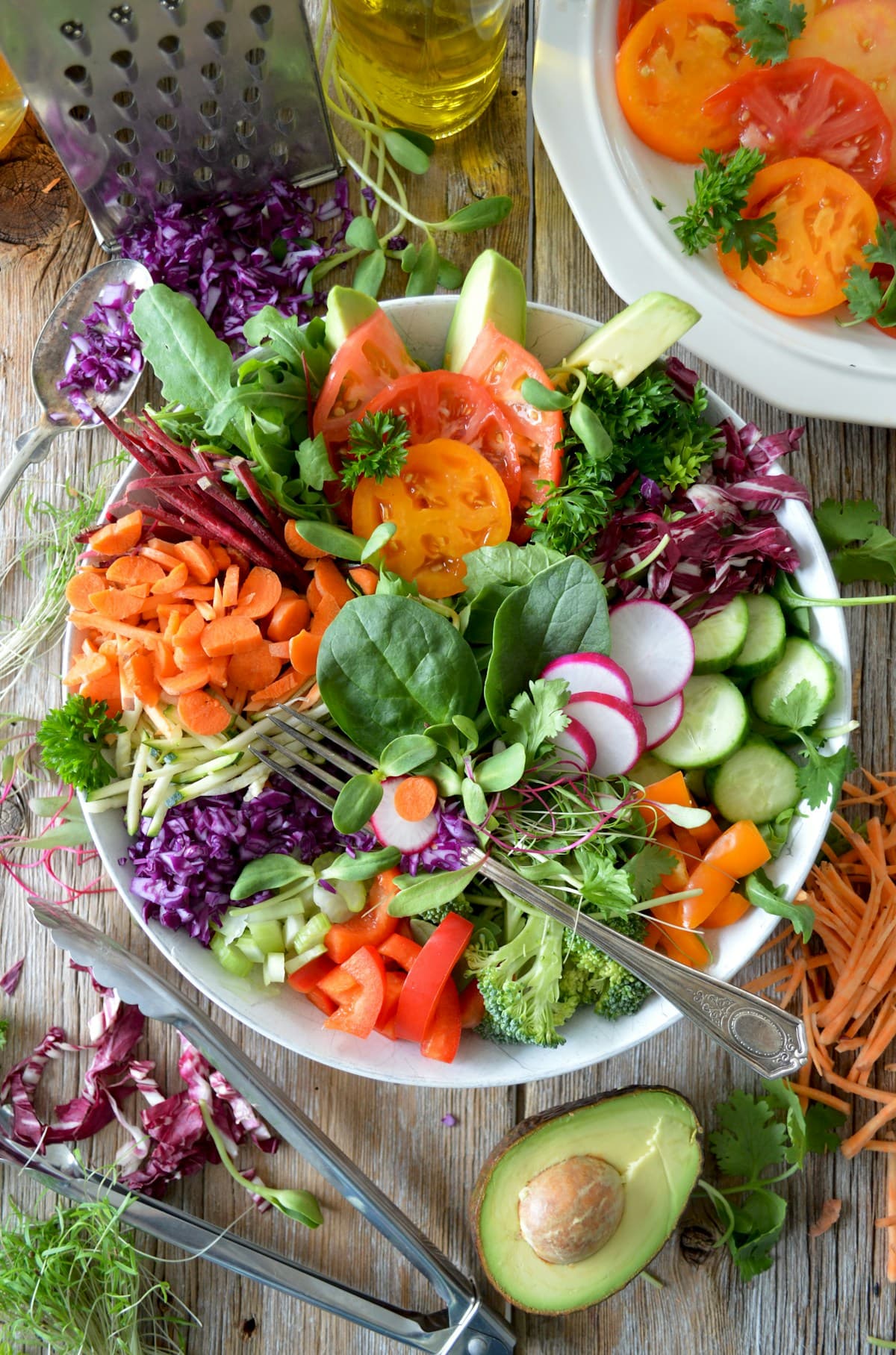 Fresh wholesome Mediterranean ingredients: olive oil, leafy greens, avocado, nuts